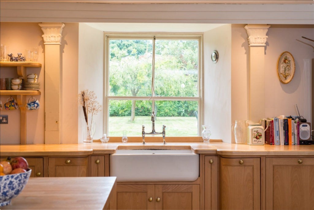 Cottage kitchen in Edward Bulmer Natural Paint rose tinted white. Colour consultancy result.