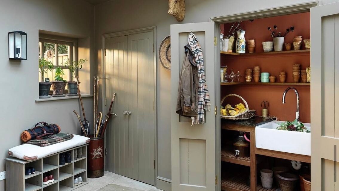 Boot room painted in Flaxen Grey with cupboard in Red Ochre by Edward Bulmer Natural Paint